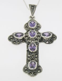 Item Details Marcasite Sterling Silver Oval Amethyst Bezel Set Large Cross w/ Chain GORGEOUS Material: .925 Sterling Silver Weight: 11.50 Grams (Including Chain) Stone: Amethyst (6) Oval Cut Amethyst stones Hand Bezel set along the whole cross. Each stone measures approx. 7x5mm and is approx 1 carat. Dimensions/Size: Cross INCLUDING BAIL measures 2.40 x 1.30 inches Chain: 18in. Box chain. .925 Sterling Silver. Made in Italy. Condition: Brand New Additional Information: This is stunning large cro Montclair Nj, Amethyst Stones, Fine Jewels, Cross Jewelry, Silver Pieces, Amethyst Stone, Fashion Jewelry Necklaces, Box Chain, 1 Carat