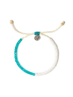 a white bracelet with blue beads and a silver owl charm on the end of it