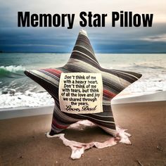 a star shaped pillow with a poem written on it in front of the ocean and sky