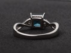 Welcome to my shop, you can find many beautiful gemstone jewelry here, and you also can ask for customized service. Main Stone: London blue topaz, princess cut, measures 6X6mm. Accent Stones: cz Metal: 925 sterling silver plated with rhodium. I also can provide metal options such as 14k solid yellow/white/rose gold Setting: prong setting more rings: https://www.etsy.com/shop/XCjewelryStudio?ref=hdr_shop_menu It's a perfect gift for the person who was born in November (Birthstone), it's quite com Elegant Square Cut Topaz Promise Ring, Elegant Princess Cut Topaz Ring With Cubic Zirconia, Elegant Princess Cut Topaz And Cubic Zirconia Ring, Princess Cut Topaz Birthstone Ring For Promise, Blue Topaz Princess Cut Promise Ring, Elegant Silver Topaz Ring With Princess Cut, Princess Cut Blue Topaz Ring For Promise, Elegant Silver Princess Cut Topaz Ring, Elegant Blue Topaz Princess Cut Jewelry