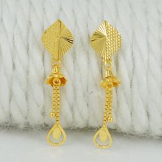 Celebrate the essence of Indian heritage with these radiant 22k gold earrings. Each earring is meticulously designed with traditional patterns that catch the light and add a regal touch to your look. Perfect for both festive occasions and elegant evenings, these earrings are a testament to the rich history of Indian jewelry, offering a blend of classic beauty and modern sophistication. 22k gold earrings handmade jewelry made in India Metal is Real Gold Not Filled or Not Gold Plated Metal - Yello 22k Gold Drop Earrings For Anniversary, Yellow 22k Gold Earrings For Anniversary, Yellow 22k Gold Drop Earrings, Yellow Gold Earrings For Anniversary And Festivals, Yellow Earrings With Intricate Design For Gift, 22k Gold Bridal Earrings For Gift, Gift Yellow 22k Gold Earrings, Hallmarked 22k Gold Danglers As Gift, Gold Danglers For Anniversary And Festivals