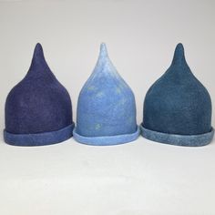 Handfelted hats for winter swimming and sauna.  Protects your head from both heat loss in cold water and from heat in the sauna. Also makes the swimming more fun.  Fine merino and supersoft. This design is called 'Tip-top'  Various colors. The saunahats are all handmade and unique. The colors can vary, also a bit from the photo. You can order for a team of swimmers and maybe have a logo added, if you have one. It takes a bit longer then. Can be used as a hat in all kinds of weather and environments. 3 sizes  Small 55-56 cm Medium 57-58 cm Large 59-60 cm Blue Outdoor Hat, Fitted Blue Outdoor Hat, Blue Handmade Outdoor Hat, Handmade Blue Outdoor Hat, Fitted Blue Felt Hat For Winter, Blue Felt Hat For Winter, Blue Mini Hats With Curved Brim For Winter, Blue Wool Hat For Winter, Blue Curved Brim Mini Hat For Winter