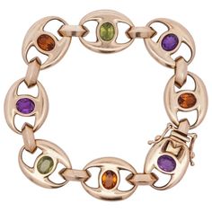 Pre-Owned 18k Yellow Gold Bracelet Comprised Of Gucci Style Links Centered By Semi Precious Stones Featuring Oval Cut Citrine, Peridot And Amethyst. Stamped On The Closure "750" And Maker "Mg". Total Bracelet Weight: 47.5 Grams (30.6 Dwt) Circa: 1980s Origin: Usa Dimensions: L: 8" Condition: Great Condition. Yellow Gold Multi-stone Oval Bracelets, Yellow Gold Multi-stone Oval Bracelet, Yellow Gold Oval Bracelet With Multi-stone, Yellow Gold Oval Multi-stone Bracelet, Luxury Multi-stone Gold Bracelet, Designer Multi-stone Gold Jewelry, Luxury Multicolor Gold Bracelet, Modern Gold Multi-stone Gemstones, Classic Gold Multi-stone Bracelets