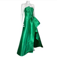 Elliatt Protea Gown In Emerald Green Xs Brand New Polyester Blend Dry Clean Recommended Partially Lined Hidden Back Zipper Closure With Faux Button Overlay Cinched Waist With Exaggerated Fabric Overlay Satin Fabric With Subtle Sheen Finish Neckline To Hem Measures Approx 63" In Length (26) Luxury Green Pre-draped Evening Dress, Pre-draped Green Evening Dress, Elegant Green A-line Gown, Green Pre-draped Evening Gown, Satin Ball Gown For Cocktail Occasions, Formal Green Ball Gown, Formal Green Ball Gown Dress, Green Ball Gown For Formal Occasions, Green Pre-draped Evening Dress With Fitted Bodice