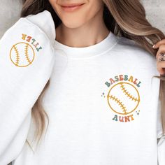 "Support your nephew at his next baseball game! This baseball aunt shirt features \"baseball aunt\" on the front pocket design and a custom sleeve design with your nephew's name and a baseball. You're sure to be the cool aunt in this sweatshirt! Also great as a gift for aunt, senior aunt, gift from nephew, gift for wife, birthday gift, or any time for a baseball lover on game day!  Your order is supporting a sports mama's small business. Thank you so much!  ♡ How to order ♡ 1. Please select a color (ash, white, sand or sport grey) and size (this is unisex sizing) 2. In the personalization box please list baseball player's name for the custom sleeve design. Because our shirts are made to order, no refunds or exchanges. However, your satisfaction is top priority, so if you have any issues, p Crew Neck Baseball Jersey For Baseball Season, Customizable Casual T-shirt With Baseball Collar, Baseball Season Relaxed Fit Sweatshirt, Personalized Crew Neck Sports Top, Customizable Cotton Casual Baseball Jersey, Casual Personalized Tops For Baseball Season, Casual Personalized Tops For Game Day, Customizable Cotton Tops With Baseball Collar, Baseball Aunt