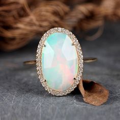 "\"Details: Item code :- ATR-2383 - 14K yellow solid gold (as shown) wt :1.26 gm - 0.17 ct diamonds - 1.96 ct opal - Ring size 17x12 mm & ring size 7 us Anjis touch jewelry supports ethical and eco-friendly practices and uses reclaimed and recycled metals whenever possible About my jewelry: All of the Anjis touch jewelry collection is handmade exclusively by me.  I hope that you will enjoy wearing my designs as much as I enjoy making them! Shipping: We have this in stock which we can ship in 2-3 Cocktail Ring Diamond, Opal Statement Ring, Yellow Gold Cocktail Ring, Boulder Opal Ring, Gold Ring Diamond, Jewelry Friendship, Ethiopian Opal Ring, Cocktail Jewelry, Gold Statement Ring