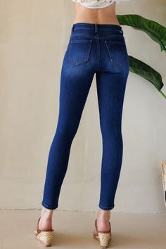 STYLE: WEP3522 | COLOR: DARKAuthentic denim fabric with High Rise Skinny JeansStone wash, Whiskers, Hand Sanding.One button closure. Zipper Fly. Regular hem.INSEAM: 28" FRONT RISE: 10"CONTENT: 73% COTTON / 25% POLYESTER / 2% SPANDEXModel in size 3.Model size : HEIGHT: 5'10" BUST: 32" WAIST: 24" HIP: 38" Care Instructions Color may transfer when new. Wash once separately in cold water before wearing. Machine wash cold inside out with like colors. Do not bleach. Tumble dry low. Cool iron if needed Stretch Dark Wash Jeans, Stretch Denim Blue Jeans With Button Zip Fly, Dark Wash Stretch Jeans, Stretch Medium Wash Jeans With Zipper Closure, Fitted Dark Wash Jeans With Zipper Closure, Distressed Mom Jeans, Dark Light, Denim Trends, Denim Branding