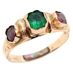 The most incredible antique 9ct gold stone ring with a dreamy forest green stone centre, and raw gold setting detail. NotesThis ring is an antique that has lived many stories in its over 150 years of life, and has signs of being resized previously such as a visible solder join and discolouration on the inside band.Some very slight indentations can be found on the green stone under inspection and a slight indentation to the metal on one side.Due to it's age, we advise this ring to be used for occ Victorian Green Jewelry Stamped 14k, Antique Emerald Ring In Stamped 14k Yellow Gold, Victorian Emerald Ring In Yellow Gold Stamped 14k, Victorian Emerald Ring In 14k Yellow Gold, Antique Gold Ruby Ring With Bezel Setting, Victorian Gold Emerald Ring, Victorian 14k Gold Emerald Ring, Victorian Emerald Ring In Yellow Gold, Heirloom Yellow Gold Emerald Ring