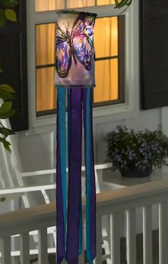 a wind chime hanging from the side of a house