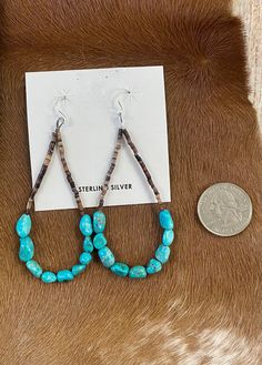 Beautiful Heshie Native American-made teardrop drop hook earrings with turquoise. The ideal jewelry item to give as a present or to keep for yourself! These are light and straightforward while still being elegant. The perfect turquoise teardrop earrings for anyone's jewelry collection!  Size: 3” inch length   Stone: Turquoise Native American Bead Jewelry, Western Style Earrings, Southwestern Turquoise Teardrop Earrings, Turquoise Dangle Jewelry With French Hook, Hypoallergenic Turquoise Teardrop Jewelry, Adjustable Teardrop Jewelry With French Hook, Adjustable Turquoise Teardrop Jewelry, Southwestern Turquoise Teardrop Earrings For Gift, Southwestern Adjustable Teardrop Earrings