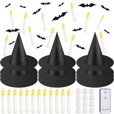 a set of halloween witches hats with candles