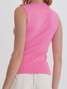 Add a touch of quirkiness to your wardrobe with the LYDIA HIGH NECK SLEEVELESS TOP. Featuring button detail at the shoulder and available in three fun colors, this knit top is perfect for those who don't take themselves too seriously. Style with your favorite jeans for a unique and fun outfit. 100% Nylon See size chart in photos. Trendy Pink Knit Top For Summer, Trendy Pink Summer Knit Top, Summer Stretch Knit Top With Ribbed Neckline, Solid Color Fine Knit Scoop Neck Tops, Solid Fine Knit Scoop Neck Top, Spring Pink Crew Neck Tank Top, Pink Crew Neck Tank Top For Spring, Chic Stretch Pink Knit Top, Fitted V-neck Knit Top For Summer