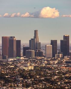 a view of the city skyline with clouds in the sky