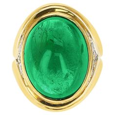 A 19.09 ct. Emerald Cabochon Ring with Diamonds made in 18 Karat Yellow Gold. The Diamonds weigh appx 0.40 carats. The total weight of the ring is 27.61 grams. The ring size is US 6. Emerald Cabochon, Cabochon Ring, The Ring, Cluster Ring, Emerald, Jewelry Rings, Ring Size, Diamonds, Yellow Gold