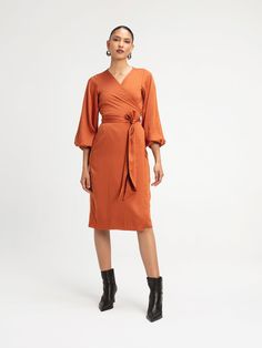 The Lala Midi is a timeless wrap designed with elasticized long sleeves for the perfect balance of style and comfort. This dress is a go-to for any occasion, combining elegance with ease. Wrap dress Elasticized sleeves Midi Length Height customization available 100% Lyocell Satin SIZINGSizes XS to 3XL CAREMachine wash cold with similar colors. Hang dry. Formal Wrap Dress With Surplice Neckline For Fall, Formal Fall Wrap Dress With Surplice Neckline, Fitted Wrap Dress For Fall, Long Sleeve Wrap Dress With Draped Sleeves For Spring, Fitted Faux Wrap Dresses For Fall, Long Sleeve Wrap Dress For Fall, Fall Fitted Wrap Dress With Surplice Neckline, Fitted Knee-length Wrap Dress For Fall, Versatile Midi Length Fall Dresses