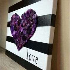 a purple heart on a black and white striped canvas with the words love $ 50