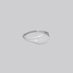 We have designed it to be smaller than a normal signet ring for a minimal and elegant look, yet still retain the classic heirloom appearance. May we suggest it might be a really cute pinky ring? Also available in Gold. Stainless Steel Band Thickness: 2mm-3mm; Oval Width: 11mm; Oval Length:7mm Adjustable Oval Dome Ring Minimalist Style, Classic Rings With Rounded Edges For Formal Occasion, Classic Hypoallergenic Open Midi Rings, Minimalist Oval Sterling Silver Signet Ring, Classic Adjustable Initial Ring With Simple Design, Adjustable Classic Midi Rings, Silver Minimalist Signet Ring, Silver Minimalist Rounded Signet Ring, Classic Initial Ring For Everyday