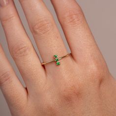 A stacking ring with a natural green tsavorite garnet in 14K solid gold. A minimalist everyday ring 3 stone ring for women with genuine gemstones. 100% handcrafted with love! * Material: 14K solid white gold, 14K yellow gold * Gemstone: Tsavorite, round cut * Gemstone's Weight: 0.06 ct HOW TO ORDER * Choose from the drop-down menus the available options (Ring size, Material) and leave us a note for any special requirements. PRODUCTION TIME - SHIPPING POLICIES * Please keep in mind that each item is handcrafted, and we need 5 days at least for its production. If you need your order on a specific date, please contact us. * All orders are shipped worldwide via FedEx Express for speed and security. The estimated delivery time is 3 days to the US and Europe and 5 days to anywhere else. * All ou Minimalist Green Emerald Ring For May Birthstone, Green Emerald Ring For Everyday Wear, Green 14k Gold Open Birthstone Ring, Everyday Yellow Gold Emerald Ring, Minimalist Green Emerald Birthstone Ring, Minimalist Green Emerald Open Ring, Stackable Green Diamond Ring In 14k Gold, Dainty Green 14k Gold Stackable Rings, Dainty Green Birthstone Ring In 14k Gold