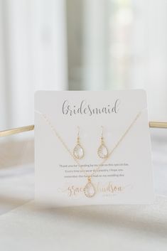 the bridesmaid necklace and earrings are on display