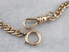 This antique double Albert watch chain is in beautiful condition! Although originally intended to hang from a waistcoat, this chain is a great length for wearing as a necklace. You could even add charms if you so wished! Metal: 14K Yellow Gold Width of Chain: 4.6 mm Length of Chain: 23 Inches Marks: "14K WV 1909" Stamped on the clasp Luxury Classic Round Emerald Necklace, Luxury Diamond Necklace With Stone Work, Luxury Square Pendant Diamond Cut Necklace, Luxury Antique Gold Watch Bands, Luxury Vintage Jewelry With Double Chain, Luxury Vintage Double Chain Jewelry, Gold Pocket Watch, Retro Era, Cuff Watch