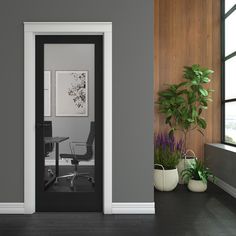 an open door leading into a room with potted plants on the floor and a chair next to it