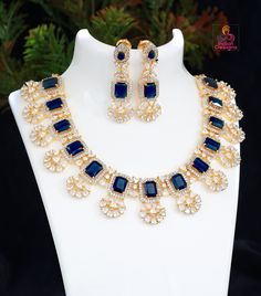 High quality designer gold plated CZ diamond Sapphire blue necklace. Blue Hand Set Bridal Necklace For Celebration, Blue Hand-set Bridal Necklace For Celebration, Blue Gold Plated Jewelry For Party, Blue Bridal Necklace Hand Set For Celebrations, Blue Diamond Necklace With Jewels, Blue Cubic Zirconia Jewelry For Celebration, Blue Gold-plated Jewelry For Party, Celebration Blue Bridal Necklace Hand Set, Blue Gemstone Jewelry For Celebration