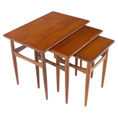 three wooden tables sitting on top of each other