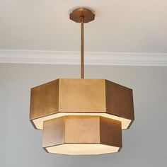 a light fixture hanging from the ceiling in a room