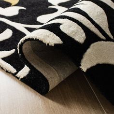 a black and white rug on the floor