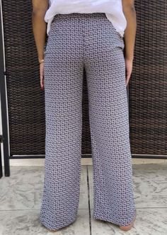 Proudly Made in USA These adorable casual fit pants feature a vintage flower pattern, relaxed fit & elastic waist. These pants are an easy go-to in your closet for daily wear or going out with the ladies. Mid rise waist Vintage Flower Print Side pockets Elastic on waist Relaxed Fit Both models are wearing size Small Style# ISP1235 Super Soft 100% Poly Machine Wash, Line Dry Size Info: Relaxed Fit:Measurements for these Pants:Waist: S 28", L 32"Rise: S 12", L 12"Total Length: S 40", L 41.5"Inseam Spring Casual Bottoms With Pattern Prints, Casual Spring Bottoms With Pattern Prints, Casual Patterned Bottoms For Spring, Casual Printed Patterned Pants, Casual Patterned Pants For Spring, Casual Patterned Bottoms With Floral Print, Casual Floral Print Patterned Bottoms, Casual Printed Ankle-length Pants, Spring Patterned Loungewear Pants