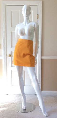 "This vintage Moschino skirt is in his iconic taxi cab/school bus yellow.  Fully lined in yellow rayon.  Side zipper with self button.  Front and back shaping seams.  Measurements -  Waist - 27' Hips - 36\" Length - 18\"" Classic Fitted School Skort, Chic Fitted School Skirt, Classic Fitted Skort For School, Chic Fitted Skirt For School, Retro High-waist Fitted Mini Skirt, Retro Fitted High Waist Mini Skirt, Retro Fitted High-waist Mini Skirt, Fitted Retro Style Mini Skirt, Fitted High Waist Retro Mini Skirt