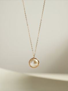 This exquisite piece combines timeless elegance with modern sophistication. Featuring a single, lustrous Edison pearl delicately suspended from a filigree chain, it exudes refined beauty and grace. Perfect for both formal occasions and everyday wear, this necklace adds a touch of understated luxury to any ensemble. Elevate your style with the timeless charm of Coco Kim. Metal: 14k Gold Filled Pearl: Freshwater Pearls Pendant Dimensions: 13mm Total Length: 450mm(includes adjustable chain) Single Pearl Pendant, Single Pearl Necklace, Edison Pearls, Single Pearl, Understated Luxury, Charm Pendant Necklace, Pearl Pendant, Charm Pendant, Freshwater Pearls