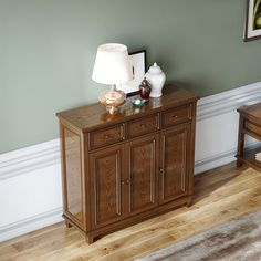 a living room with two chairs and a small table in the corner next to it