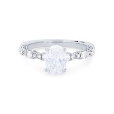 an oval cut diamond ring set in 18k white gold