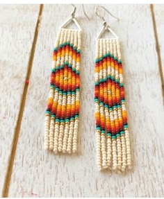 Sunset beaded hanging 3inch earrings. Bead Work Earrings, Big Beaded Earrings, Indigenous Beadwork Earrings, Bohemian Triangle Jewelry With Dangling Beads, Seed Bead Patterns Earrings, Bohemian Triangle Beaded Earrings, Adjustable Triangle Beaded Earrings, Adjustable Triangular Beaded Jewelry, Adjustable Triangle Beaded Jewelry