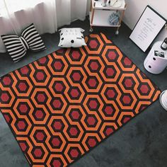 the carpet is made up of red and black hexagonal shapes