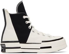 High-top paneled canvas sneakers in white and black. Asymmetric construction. · Round rubber cap toe · Lace-up closure · Logo patch and grommets at inner side · Rubberized logo patch at textured rubber midsole · Treaded rubber outsole · Platform: H1.5 in Supplier color: Egret/Black/Egret White Chuck 70, Chuck 70 Plus, Women Attire, White Chucks, Black Chucks, Black And White Converse, Converse New, New Converse, Converse White