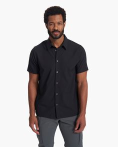 Light, stretchy and smooth on the skin, our performance woven shirt combines a tailored shape with endless wearability, made from 100% recycled fabric. This short-sleeved button down is designed for days when you want to look and feel like a premium feature. | Vuori Short Sleeve Manhattan Button Down | Black | Medium Vuori makes premium performance apparel inspired by the active Coastal California lifestyle; an integration of fitness, surf, sport, and art. Breaking down the boundaries of traditi Workwear Tops With Functional Buttons And Short Sleeves, Versatile Short Sleeve Shirt With Button Closure, Coastal California, Black Shorts Men, California Lifestyle, California Coastal, Performance Outfit, Recycled Fabric, Black Media