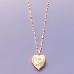 Ross-Simons - Plain - 14kt Yellow Gold Heart Locket Necklace. 20". Make her day with our luxe symbol of love! Crafted in polished 14kt yellow gold, our heart locket necklace is a timeless choice for so many occasions. Fits a 5/16" x 3/8" photo inside. Suspends from a rope chain. Springring clasp, 14kt yellow gold heart locket necklace. Elegant Personalized Medallion Heart Necklace, Personalized Medallion Heart Necklace, Luxury Personalized Jewelry For Valentine's Day, Engraved Yellow Gold Locket Necklace For Valentine's Day, Elegant Yellow Gold Locket Necklace For Valentine's Day, Luxury Engraved Necklaces For Valentine's Day, Luxury Engraved Necklace For Valentine's Day, Elegant Heart Medallion Necklace For Valentine's Day, Engraved Locket Necklace For Valentine's Day Formal Occasions