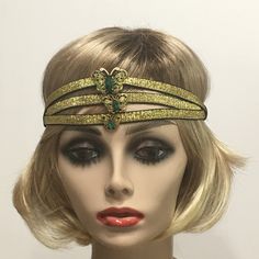 Great Gatsby headpiece, 1920s headband, Flapper headpiece, Gatsby headband, Vintage Inspired, Roaring 20s,  Art Deco, 1920s hair accessory This listing is for a Great Gatsby Headpiece. Made with three rows of a beautiful  Black and Gold metallic trim backed with black satin elastic. I embellished the center of this headpiece with a Vintage Antique Gold and Green Butterfly Rhinestone brooch.   Each piece is uniquely made one at a time with much thought, love and time. In most cases there is only one of a kind. I have designed and created each piece from my smoke-free, pet- free studio.   All pieces are securely wrapped and boxed to prevent damage/breakage. This item is ready to ship! If you have any inquiries, please feel free to convo me. Thank you very much for stopping by at my shop. Hav Vintage Adjustable Fascinator Headband, Adjustable Wedding Headband Costume Accessory, Gold Headband Headpieces For Carnival, Vintage Headband Costume Hat For Party, Vintage Costume Headband For Party, Vintage Adjustable Costume Hats And Headpieces For Party, Vintage Adjustable Costume Hat For Costume Party, Vintage Adjustable Costume Accessories For Costume Party, Adjustable Gatsby Style Costume Hats For Evening