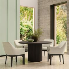 a dining table with four chairs around it in front of a large window that looks out onto the outdoors