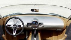 the interior of a car with leather and wood trim