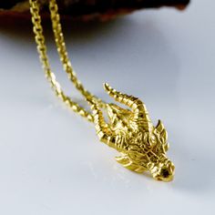 New handmade dragon head pendant in 10k, 14k or 18k gold in a smaller size that can also serve as a charm to combine with others, both on necklaces and bracelets. We are very proud of the design of this new dragon. We have modeled the head first in wax and then cast it in silver. We have taken care of every detail. Then it was worked directly on the metal to achieve different finishes and textures. The dragon has always been present in the thoughts of men, from legend, religion and even fantasy, Spiritual Gold Jewelry With Dragon Design, Yellow Gold Jewelry With Dragon Design For Gift, Yellow Gold Necklace With Dragon Design As Gift, Gold Round Pendant With Dragon Design, Dragon Necklace Gold, Luxury Yellow Gold Necklace With Dragon Design, Yellow Gold Dragon Design Jewelry Gift, Gold Dragon Design Round Pendant Jewelry, Yellow Gold Dragon Design Pendant Jewelry