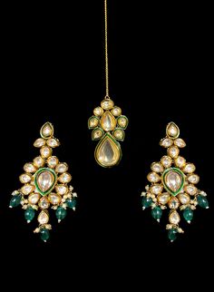 Ariana - Modern Kundan Bridal Jewelry with Pearls, Meenakari & Emeralds Contemporary Indian bridal set makes every bride's outfit perfect. This Kundan stone setting jewelry set is accented with gorgeous Polki gemstones making it one of a kind. Stunning emerald drops adorn this beautiful choker & earrings. It is further accented with extraordinary luxury pearl drops. This jewelry set is sure to make you stand out from the crowd with its elaborating green outline like Meenakari handwork. This chok Green Stone Work Chandbalis For Weddings, Fusion Kundan Jewelry Sets With Meenakari, Traditional Kundan Necklace With Meenakari And Emerald, Traditional Emerald Bridal Necklace With Stone Work, Wedding Green Meenakari Chandbalis, Green Cutdana Chandbalis For Wedding, Hand Set Kundan Chandbali Traditional Wear, Green Kundan Chandbalis For Wedding, Hand Set Emerald Jewelry Sets For Wedding