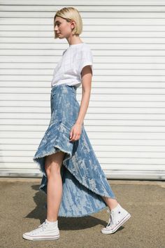 A distressed denim skirt with front closure and asymmetric hemline. Matching top FT1215 Details: Self : 78% Cotton 22% Polyester Size & Fit - Model is 5`9" And Wearing Size Small- Measurements Taken From Size Small- Approx. length: Left 17 3/4"; Right 39 3/4" Fitted Medium Wash Bottoms With Asymmetrical Hem, Asymmetrical Hem Denim Skirt In Medium Wash, Asymmetrical Medium Wash Bottoms For Summer, Denim Blue Asymmetrical Skirt For Summer, Denim Blue Skirt With Asymmetrical Hem For Summer, Spring Asymmetrical Denim Bottoms, Asymmetrical Fitted Denim Skirt For Spring, Chic Asymmetrical Fitted Denim Skirt, Chic Fitted Asymmetrical Denim Skirt