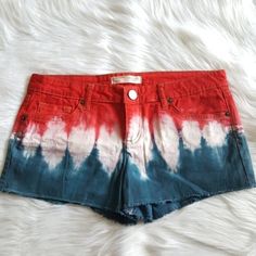 Size 11 Juniors Shorts In Tie Dye Red, White, And Blue. 5 Pockets. Frayed Edges. Perfect 4th Of July, Patriotic Shorts. New Without Tags Flat Lay Measurements: 16" Waist And 2.5" Inseam Red Shorts For Beach On 4th Of July, Patriotic Cotton Shorts For Spring, Patriotic Blue Cotton Shorts, Patriotic Red Short-length Bottoms, Red Shorts For 4th Of July, Red Cotton Shorts For Summer, Blue Jean Shorts For 4th Of July, Red Fitted Patriotic Bottoms, Trendy Cotton Shorts For 4th Of July