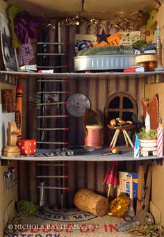 a doll house is shown with various items in the shelves and decorations on the shelf