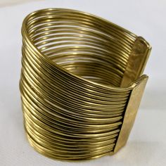 Elegant Adjustable Brass Cuff Bracelet, Gold Bracelet Jewelry For Spring, Spring Gold Bracelet Jewelry, Gold Spring Bracelet, Gold Bangle Bracelets For Spring, Modern Gold Bracelets For Spring, Gold Bangle Bracelet For Spring, Gold Metal Jewelry For Spring, Adjustable Gold Metal Bracelets