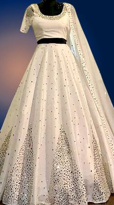 Ivory Lehenga Choli White Anarkali Gown With Cutdana, White Anarkali Tissue Silk Choli, White Anarkali Choli In Tissue Silk, White Gown With Cutdana In Traditional Drape, Tissue Silk Cutdana Wedding Dress, Wedding Dress In Tissue Silk With Cutdana, Designer White Tissue Silk Lehenga, Designer Tissue Silk White Lehenga, White Anarkali Lehenga In Tissue Silk