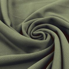 a close up shot of a green fabric